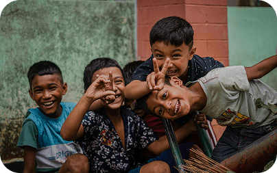 Smiling children with hands forming hearts